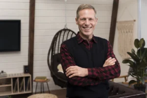smiley man posing with arms crossed